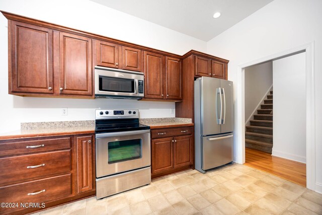 kitchen featuring light hardwood / wood-style flooring and stainless steel appliances