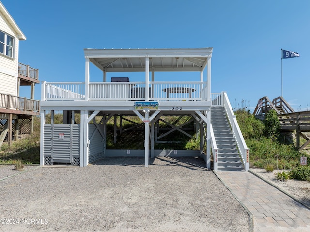 coastal inspired home featuring a carport