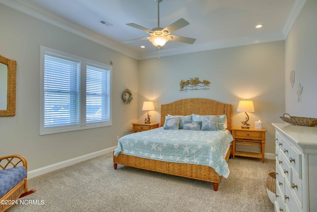 bedroom with baseboards, visible vents, a ceiling fan, light colored carpet, and crown molding