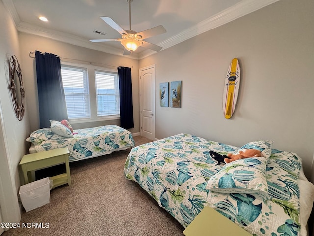 carpeted bedroom with a ceiling fan, visible vents, and crown molding