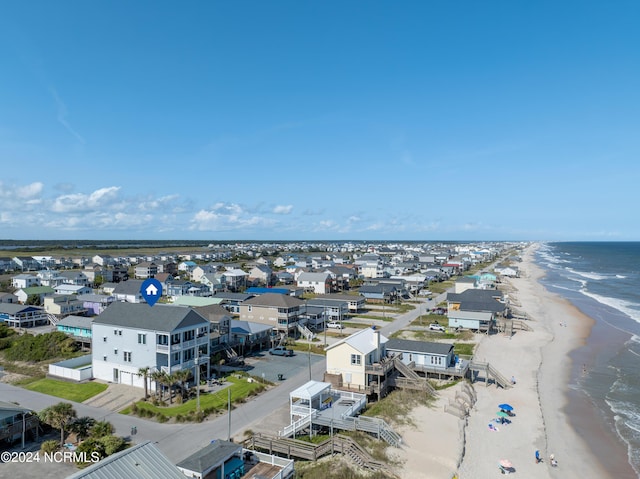 aerial view with a water view, a residential view, and a view of the beach