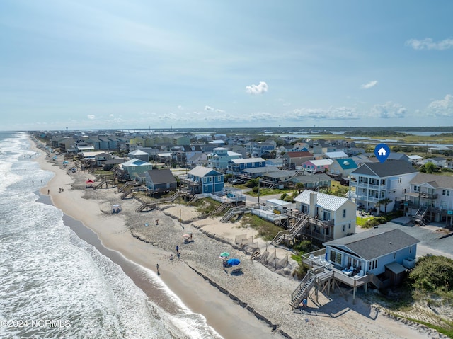 aerial view featuring a residential view, a water view, and a beach view