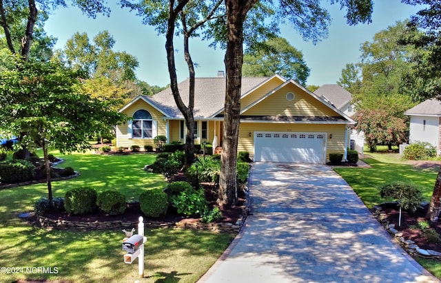 single story home with a garage, decorative driveway, and a front yard