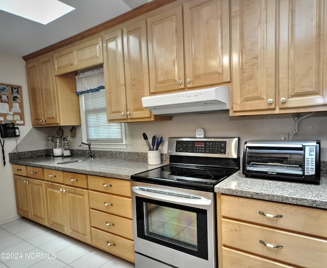 kitchen featuring a toaster, stone countertops, stainless steel electric range, under cabinet range hood, and a sink