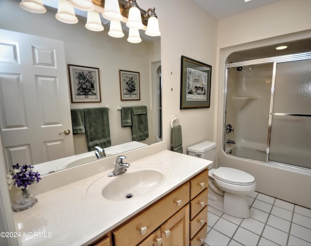 full bathroom featuring tile patterned flooring, vanity, toilet, and enclosed tub / shower combo