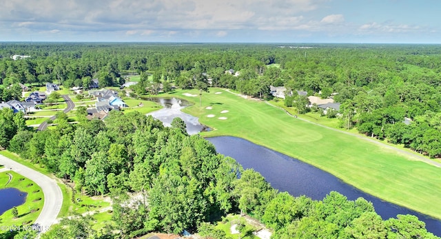 drone / aerial view featuring golf course view, a water view, and a wooded view