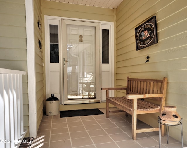 view of exterior entry featuring radiator heating unit