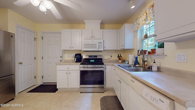 kitchen with white cabinetry, sink, stainless steel appliances, and ceiling fan