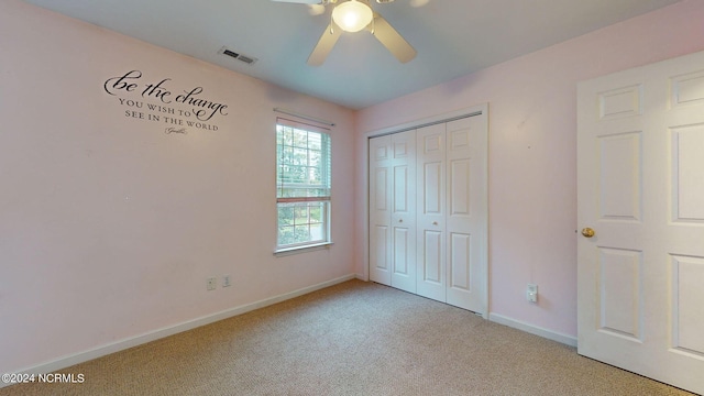 unfurnished bedroom featuring a closet, ceiling fan, and light carpet