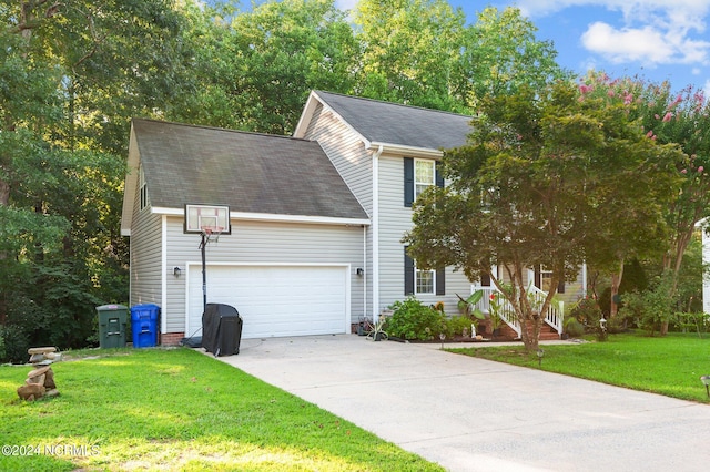 view of front of house featuring a garage and a front yard