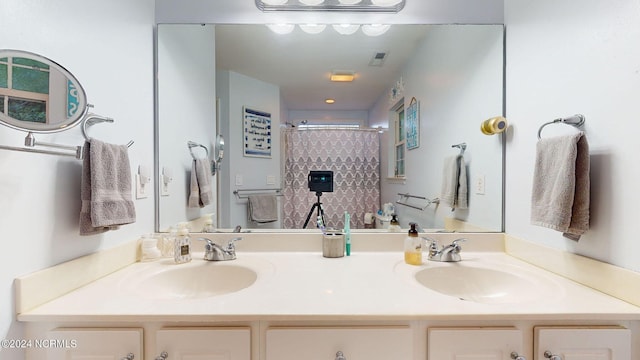 bathroom with vanity and walk in shower