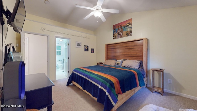 carpeted bedroom with lofted ceiling, ensuite bathroom, and ceiling fan