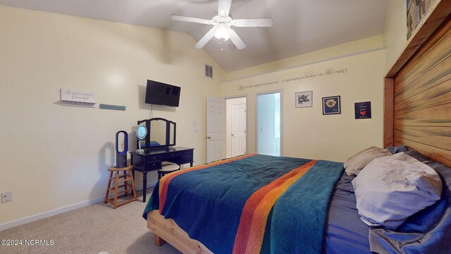 bedroom with lofted ceiling, ceiling fan, and carpet floors