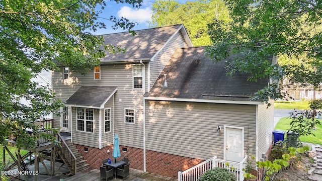 rear view of property with a deck