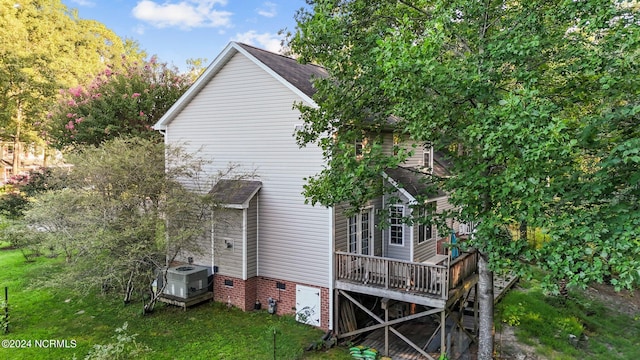 back of property with a wooden deck