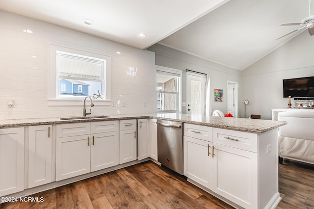 kitchen featuring sink, ceiling fan, dark hardwood / wood-style floors, stainless steel dishwasher, and white cabinets