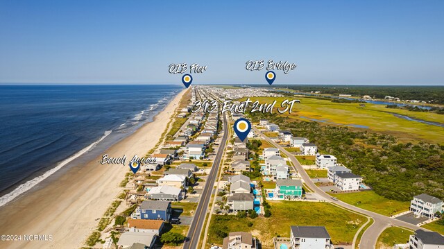 drone / aerial view featuring a view of the beach and a water view