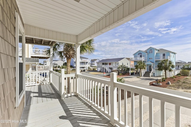 wooden deck featuring a residential view