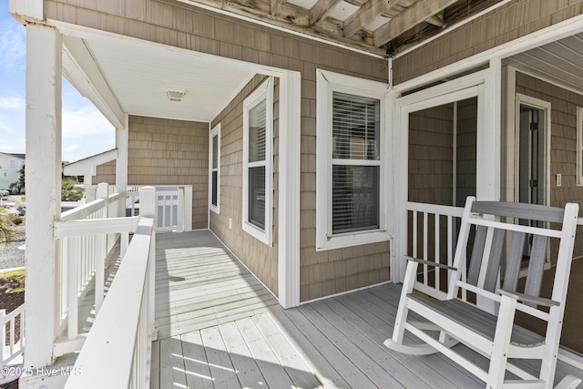 wooden deck featuring a porch