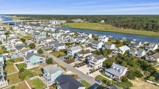 drone / aerial view with a water view and a residential view