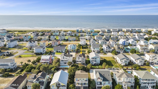 birds eye view of property with a water view and a residential view