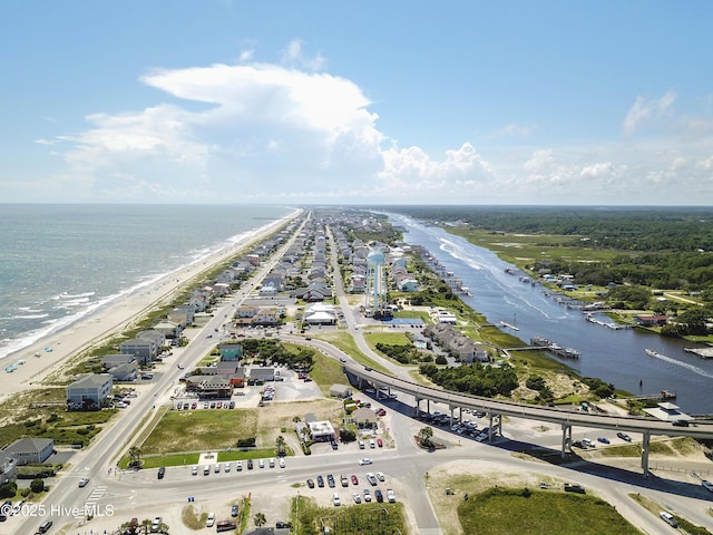 aerial view with a water view and a view of the beach