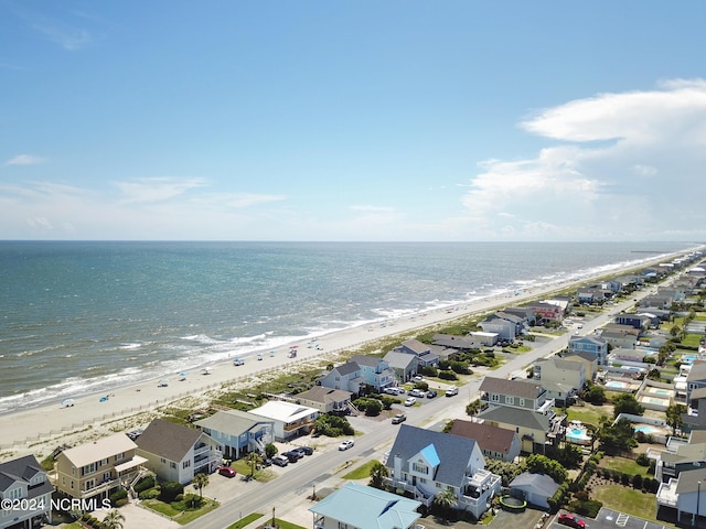 drone / aerial view with a water view, a residential view, and a beach view