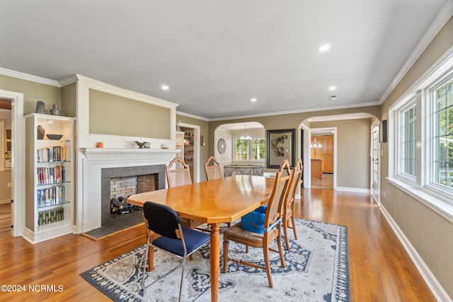 dining room featuring ornamental molding and wood-type flooring