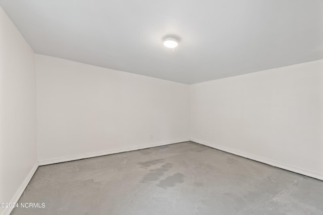 spare room with concrete flooring