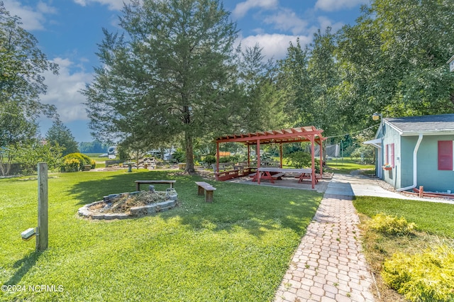 view of yard with a pergola and a patio area