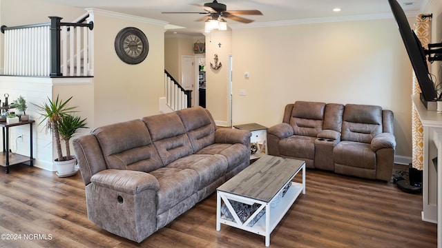 living room with crown molding, dark hardwood / wood-style floors, and a chandelier