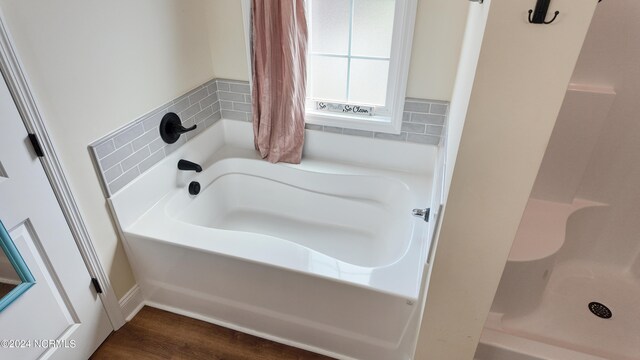 bathroom with vanity, a chandelier, and separate shower and tub