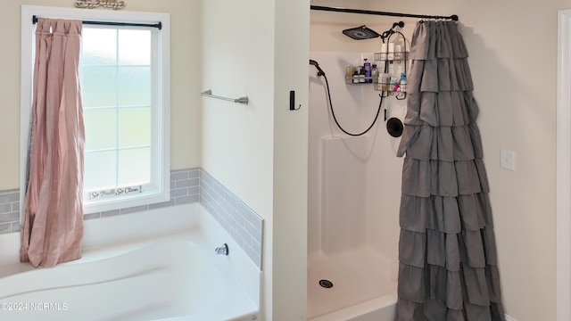 bathroom with vanity, hardwood / wood-style floors, an inviting chandelier, and a bathing tub