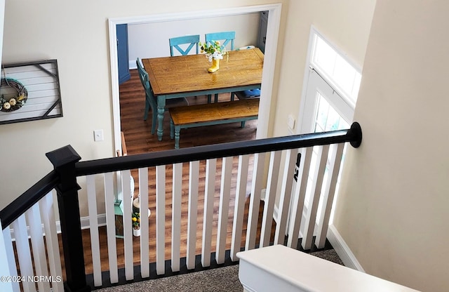 stairway with wood-type flooring