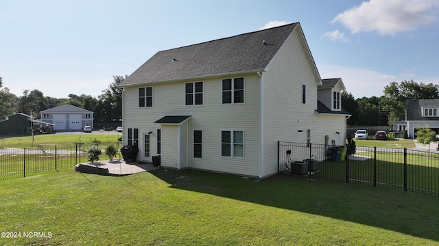 back of house with a yard and a patio area