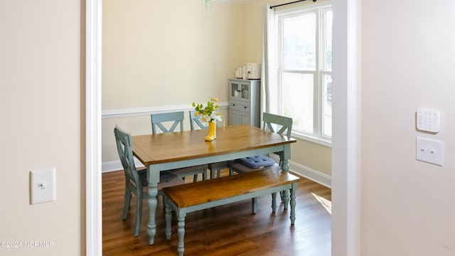 dining space with hardwood / wood-style floors