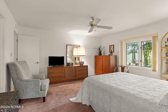 bedroom featuring light carpet and ceiling fan