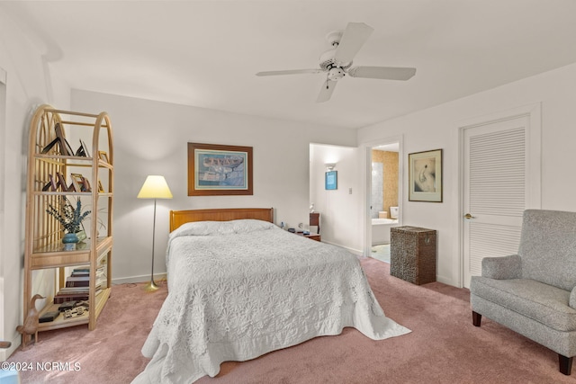 carpeted bedroom featuring ceiling fan and ensuite bathroom