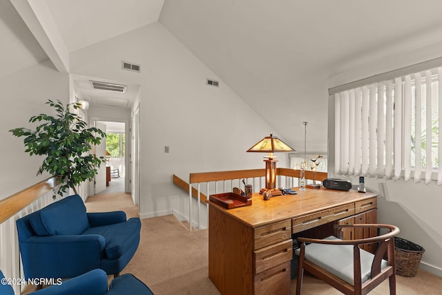 carpeted office with lofted ceiling