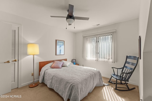 carpeted bedroom featuring ceiling fan