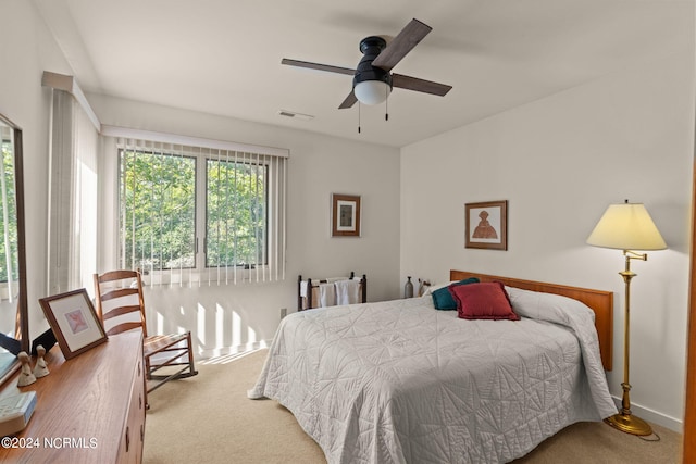 carpeted bedroom featuring ceiling fan