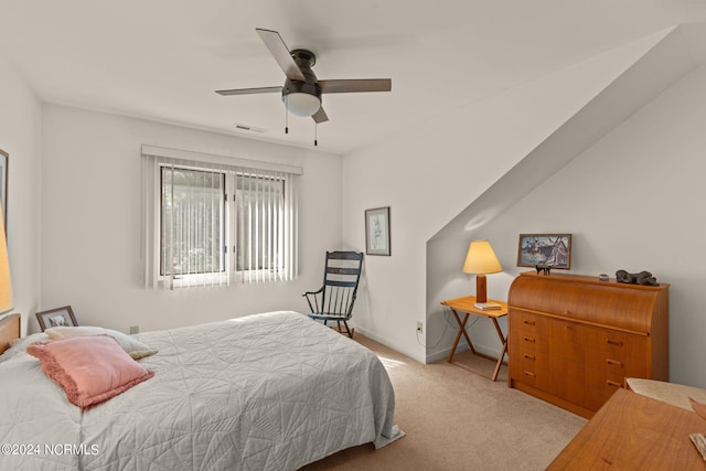 bedroom featuring ceiling fan and light colored carpet