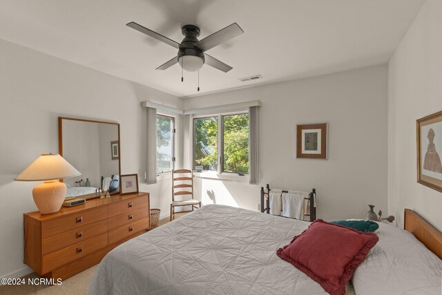 bedroom with ceiling fan and carpet floors