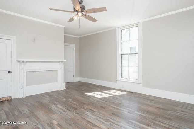 unfurnished living room featuring crown molding, a wealth of natural light, wood-type flooring, and ceiling fan