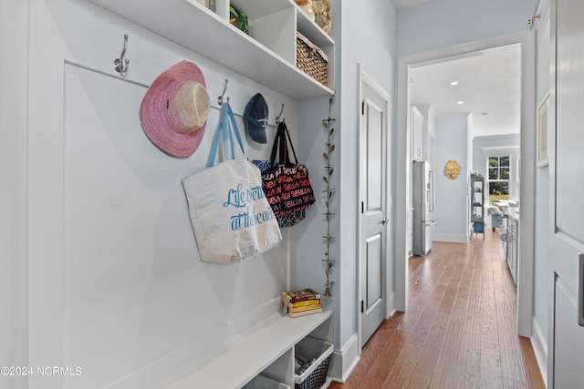 mudroom featuring recessed lighting, baseboards, and wood finished floors