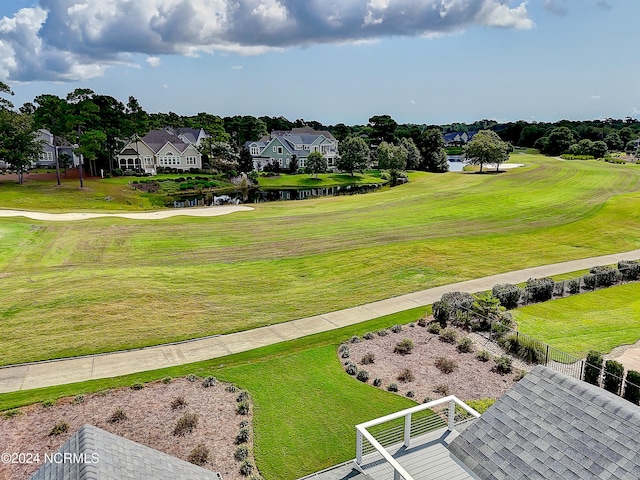 surrounding community with a yard and fence