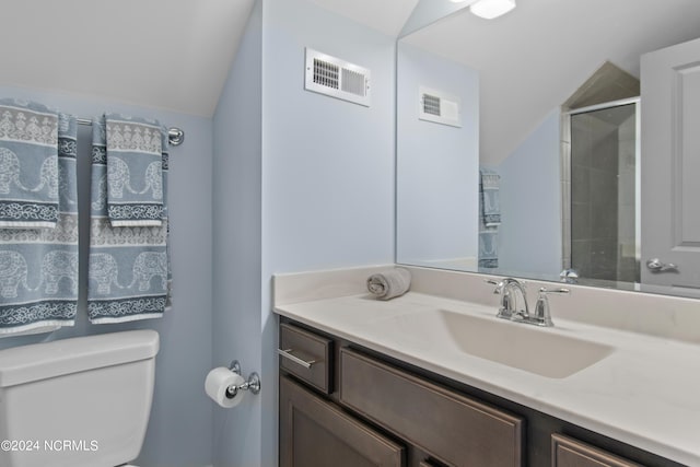 bathroom featuring toilet, vanity, lofted ceiling, and visible vents