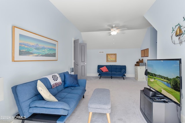 living room with visible vents, a ceiling fan, carpet flooring, vaulted ceiling, and baseboards