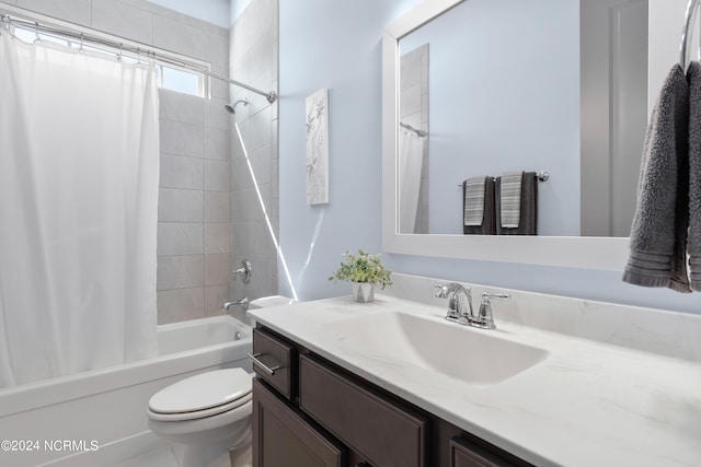 bathroom featuring toilet, shower / bath combination with curtain, and vanity