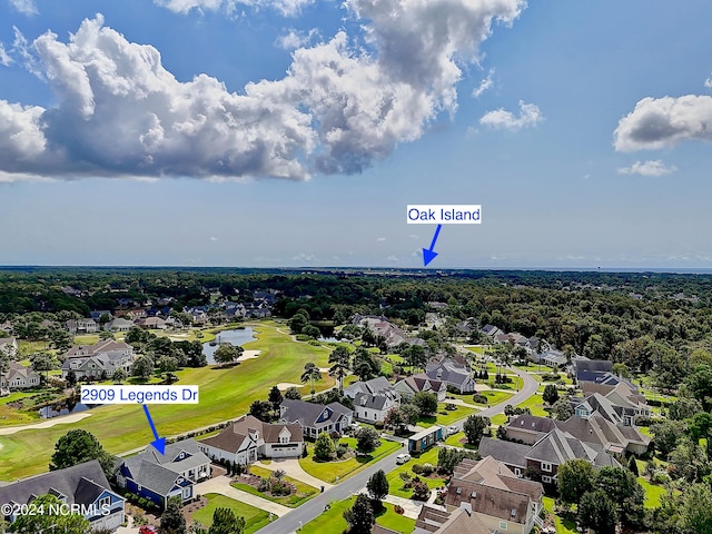 birds eye view of property featuring view of golf course and a residential view